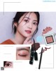 a magazine page with a picture of a woman's face and makeup