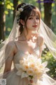 A woman in a wedding dress holding a bouquet of flowers.